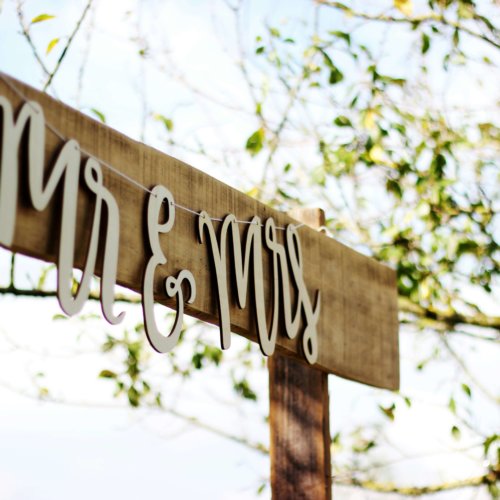 Mr and Mrs string sign on wood board